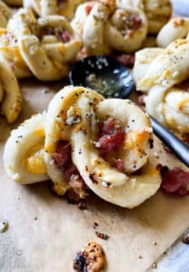 Close up of freshly baked garlic knot with ham and cheese