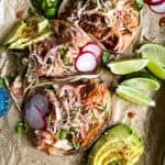 salmon tacos with avocados, lime, and jalapeno for a taco tuesday spread