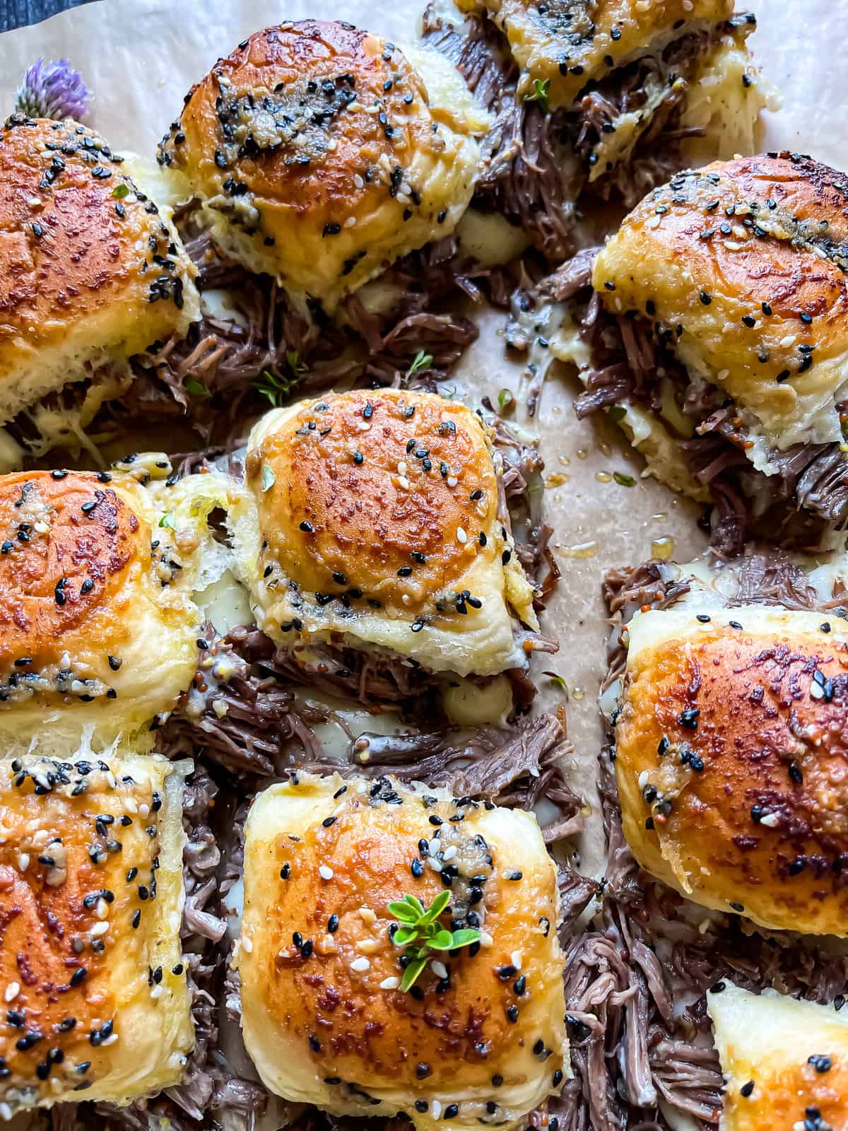 instant pot French dip sliders pulled apart to reveal melted cheese