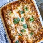 creamy pesto ricotta lasagna with fresh herb garnishes
