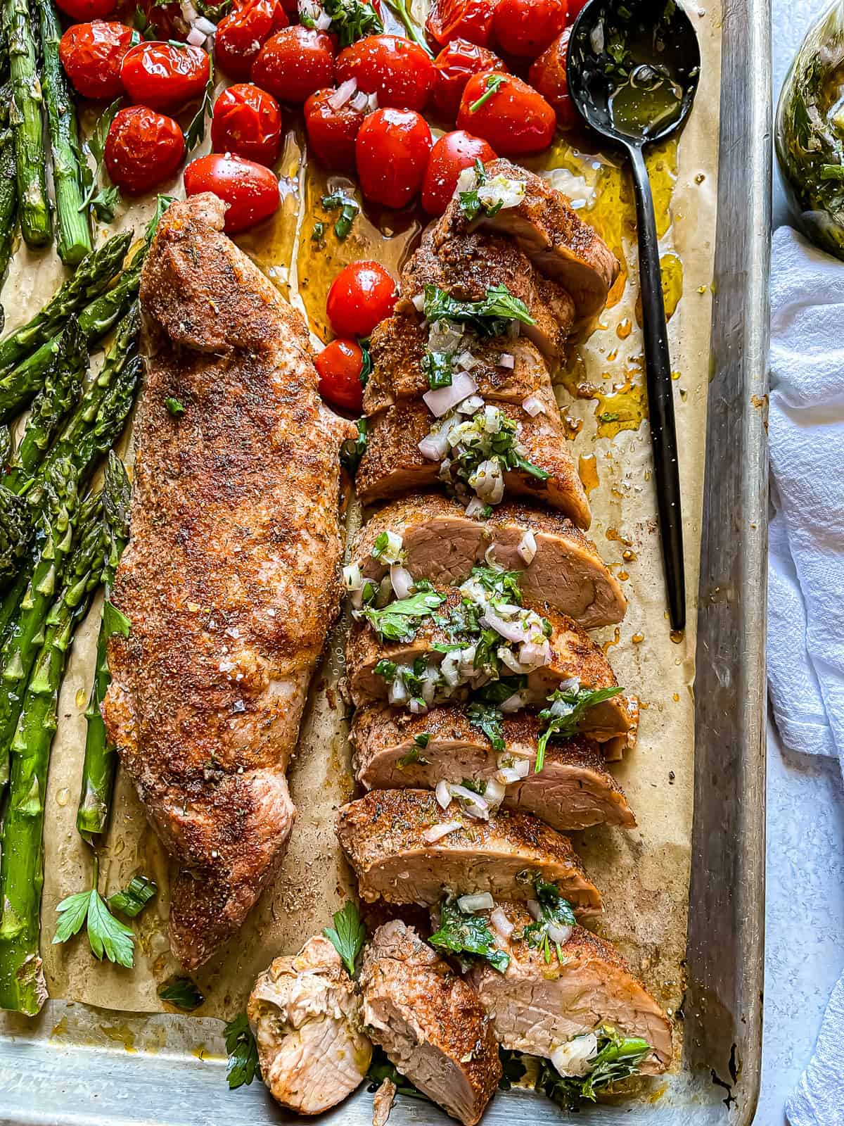 sheet pan pork tenderloin with roasted tomatoes, asparagus, and chimichurri