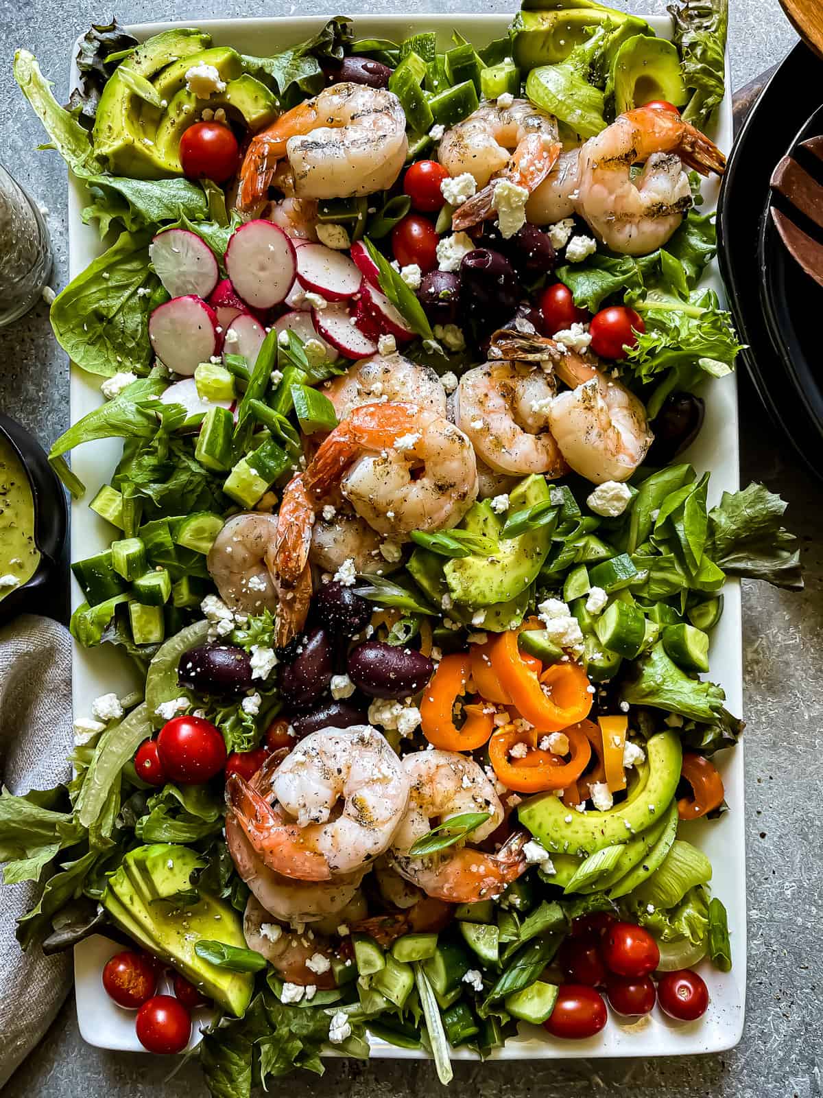 grilled shrimp salad with mixed greens, veggies, and a green onion vinaigrette