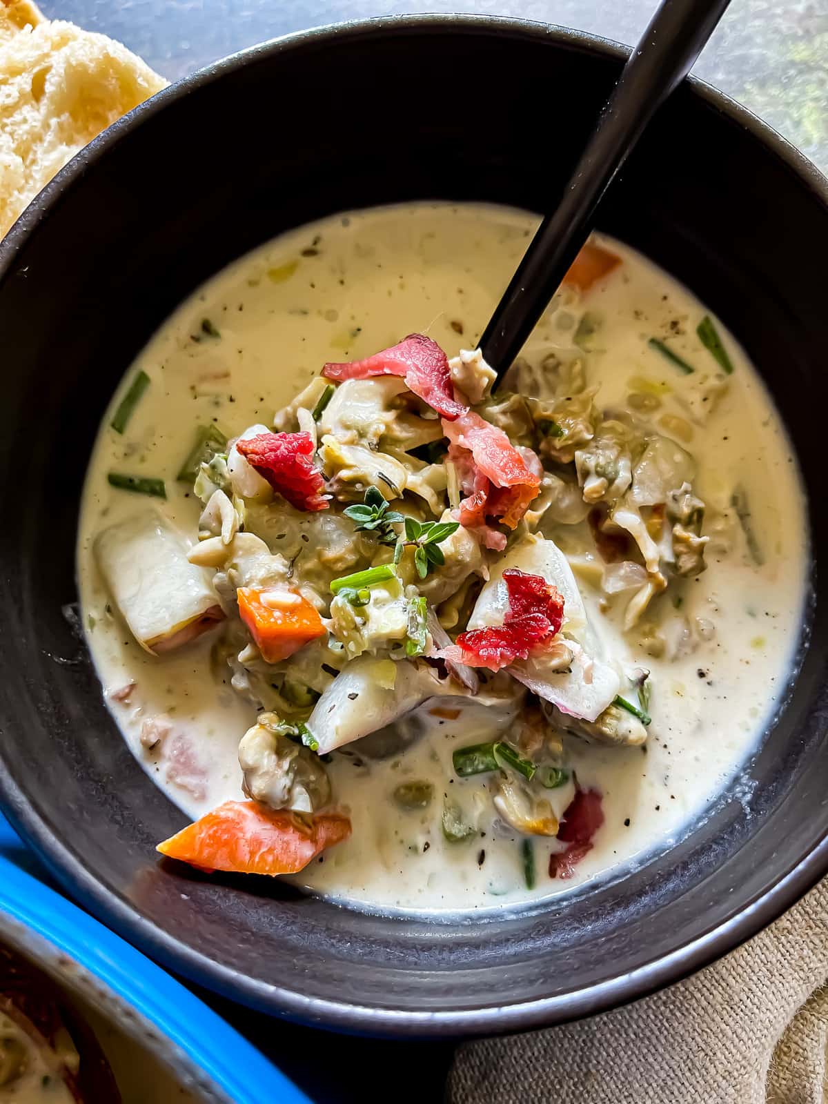 chowder with clams, vegetables, and bacon