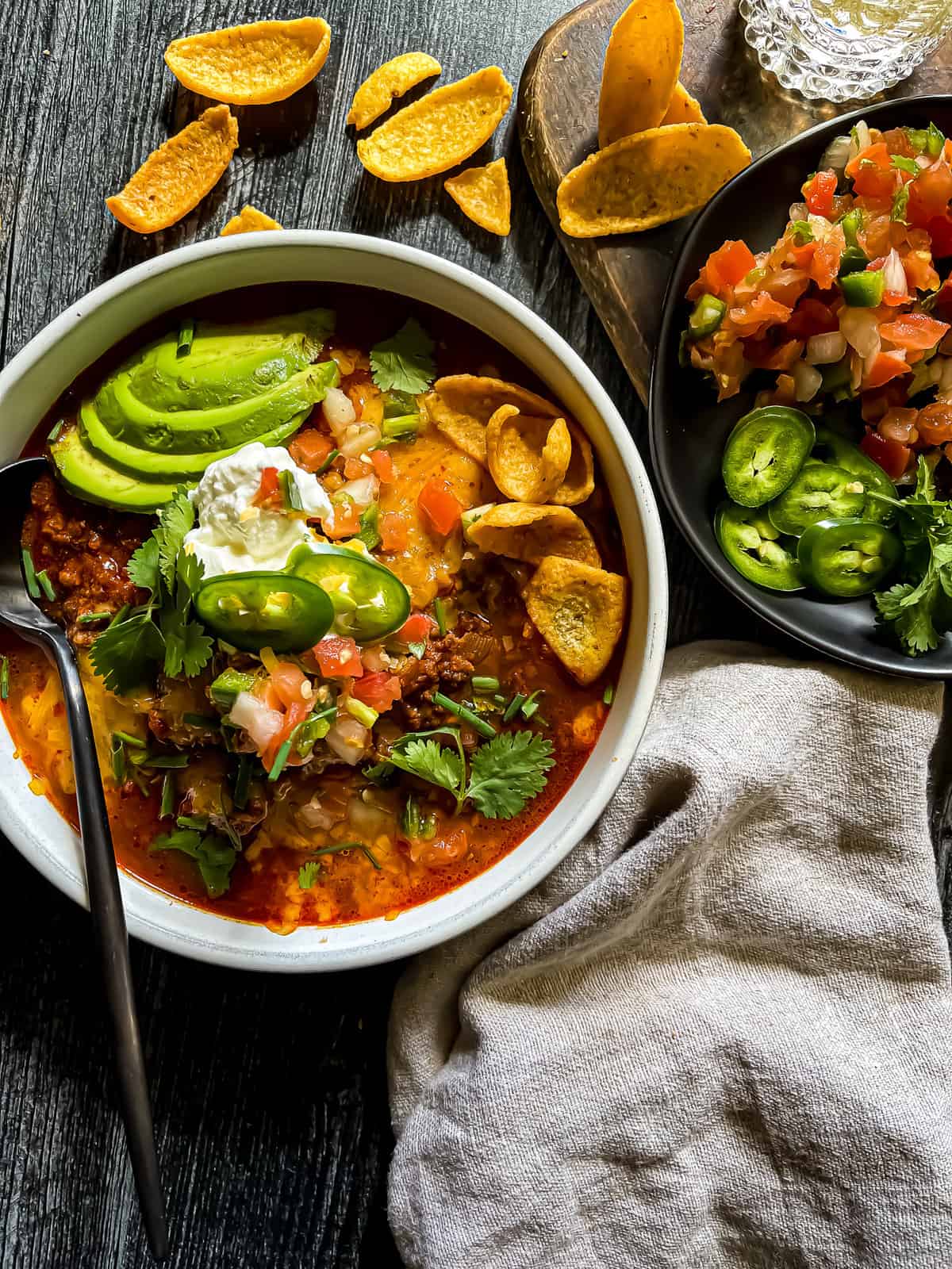 beef chili bowl with garnishes