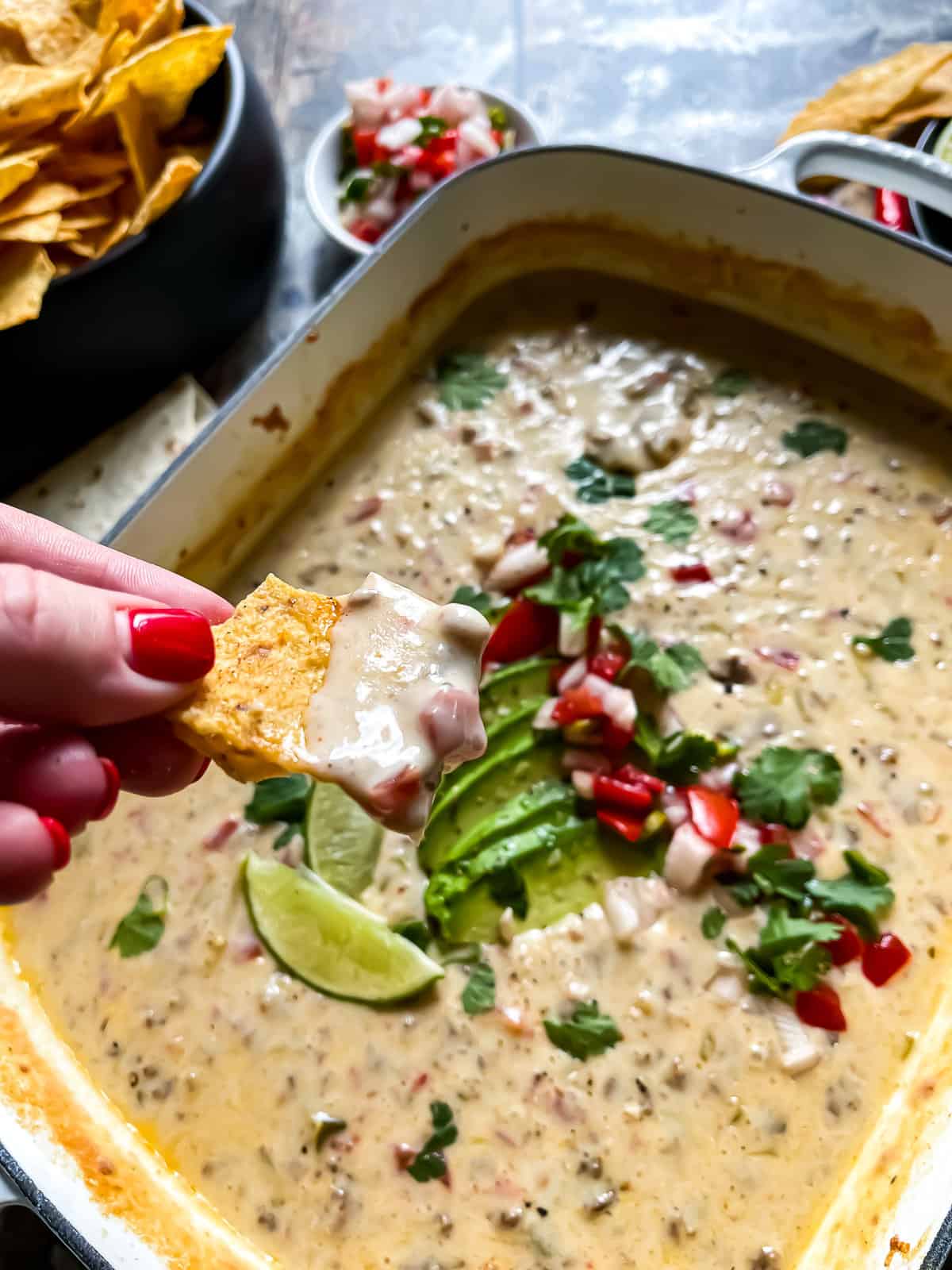 tortilla chip dipped in queso for super bowl recipes roundup