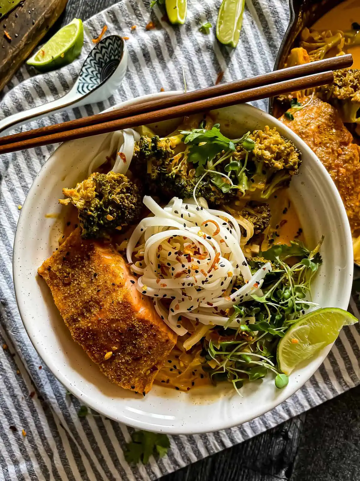 bowl of curry with salmon and rice noodles