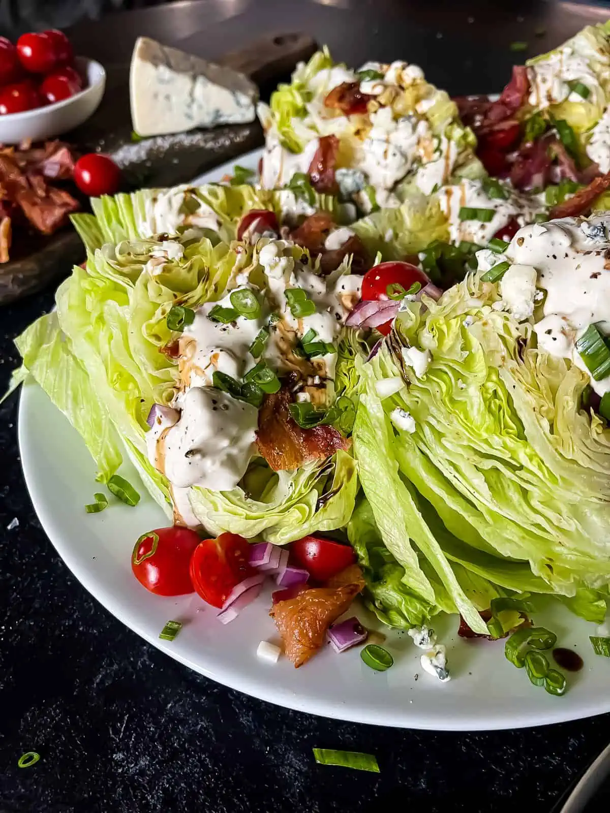 wedge salad with blue cheese, bacon, and tomatoes