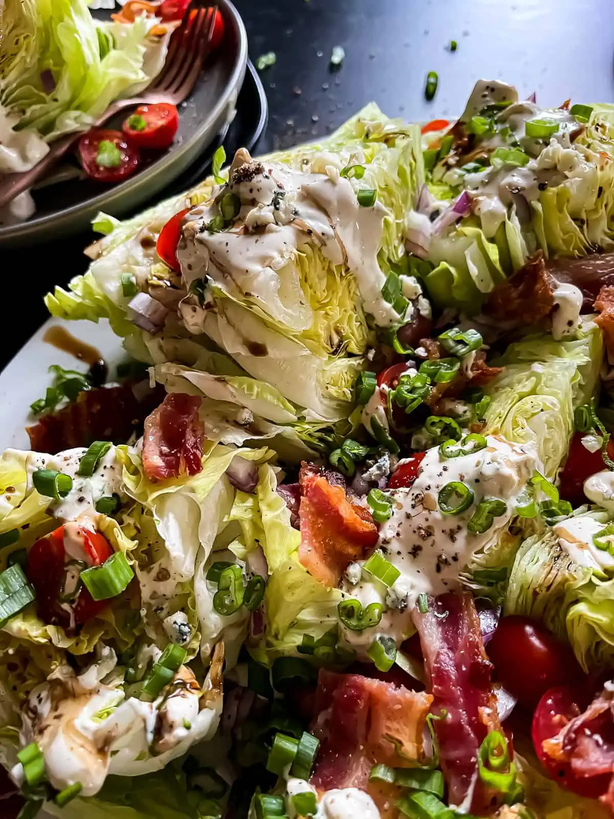 wedge salad with blue cheese, bacon, and tomatoes