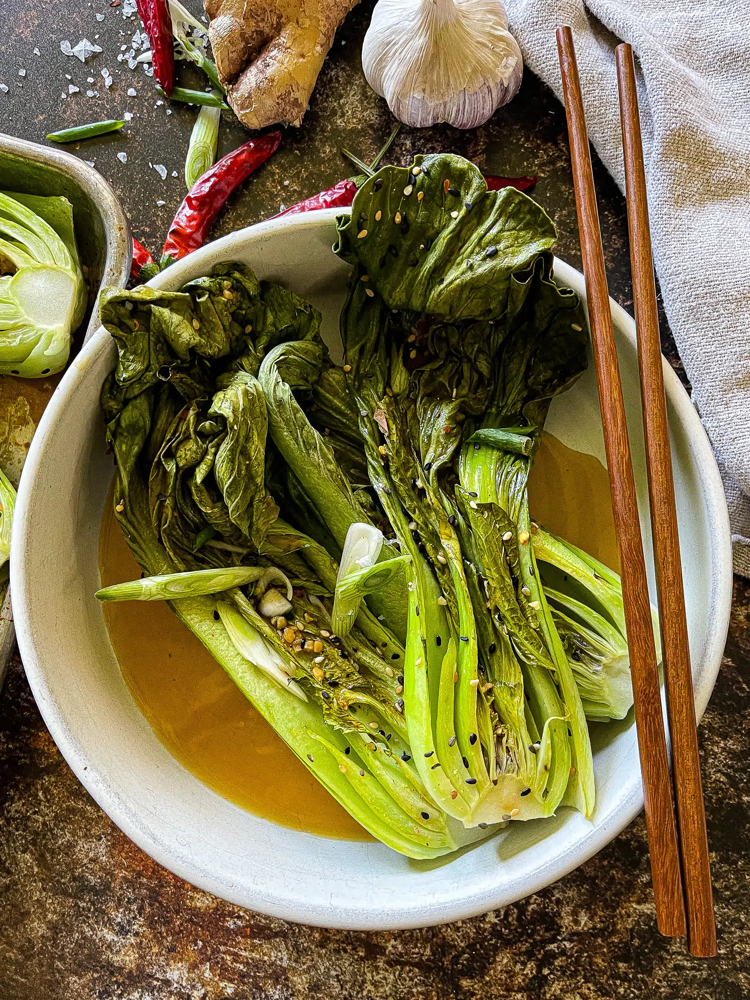 halved bok choy, roasted on a sheet pan, with a soy ginger garlic sauce