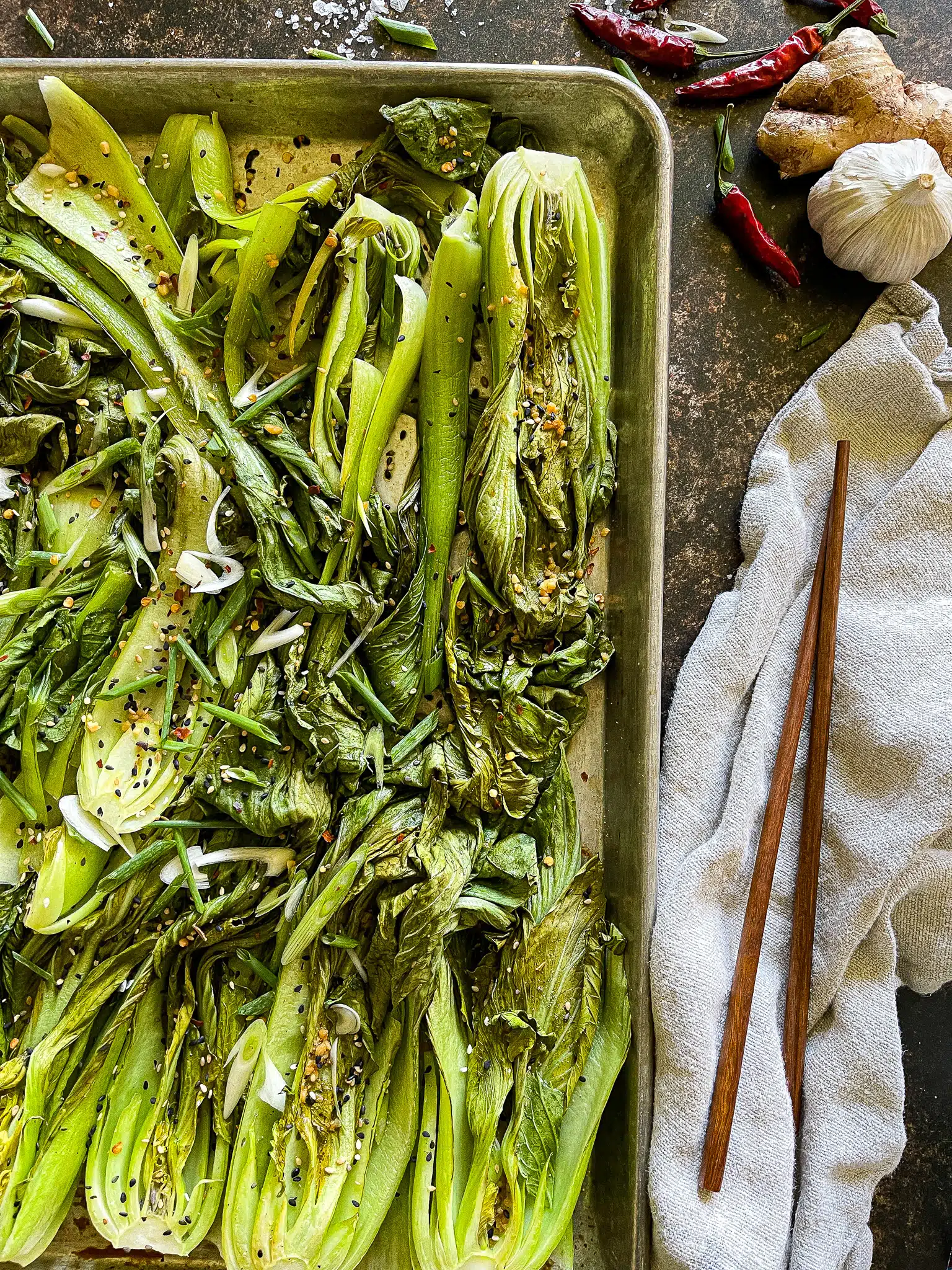 halved bok choy, roasted on a sheet pan, with a soy ginger garlic sauce