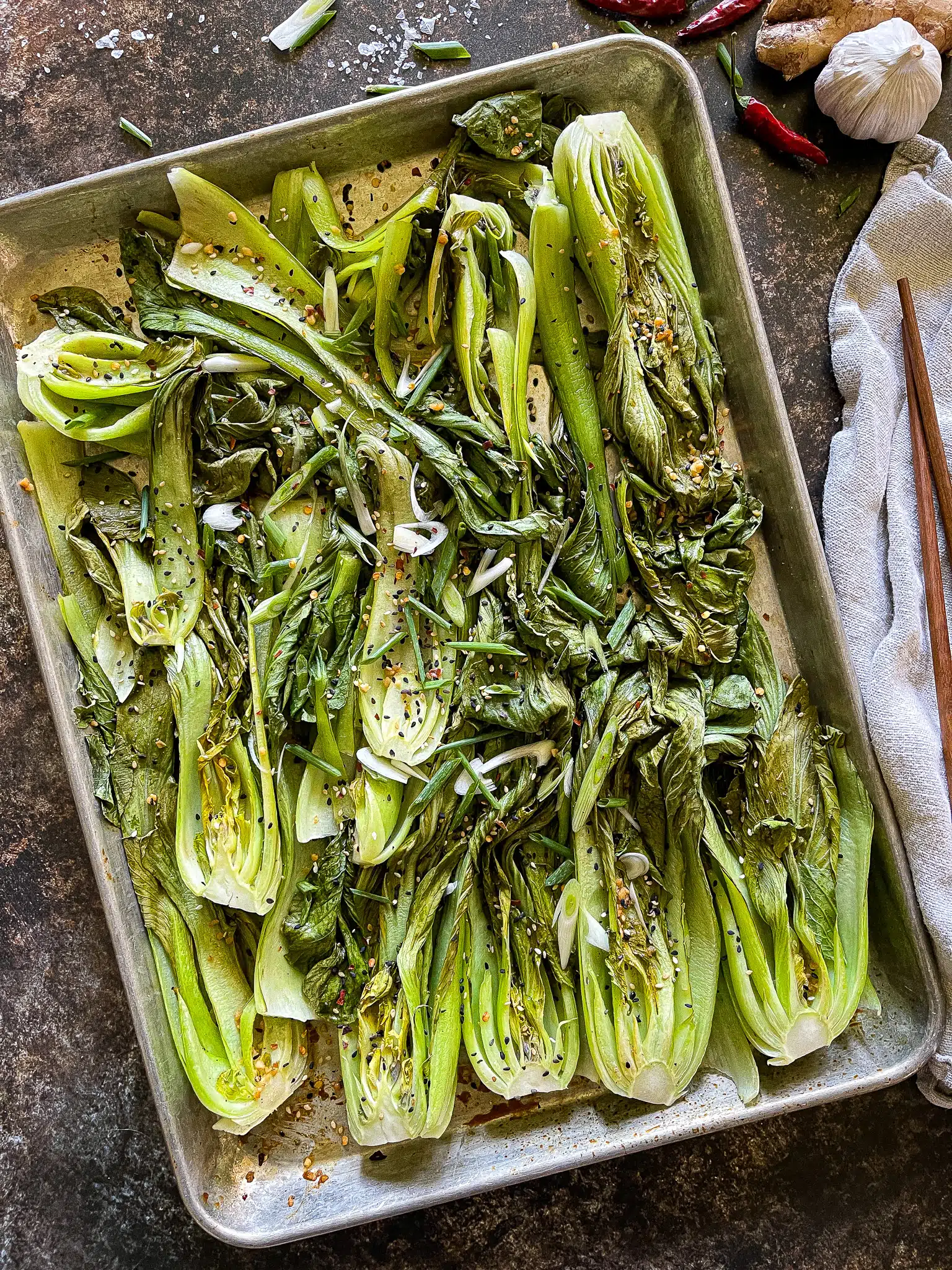 halved bok choy, roasted on a sheet pan, with a soy ginger garlic sauce