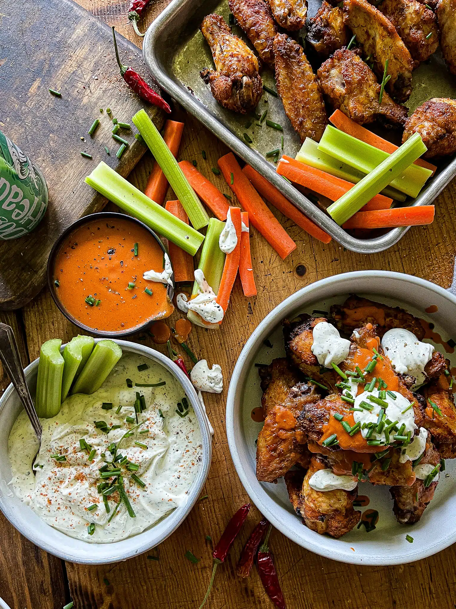 air fryer chicken wings with buffalo and ranch sauces, with carrots and celery sticks