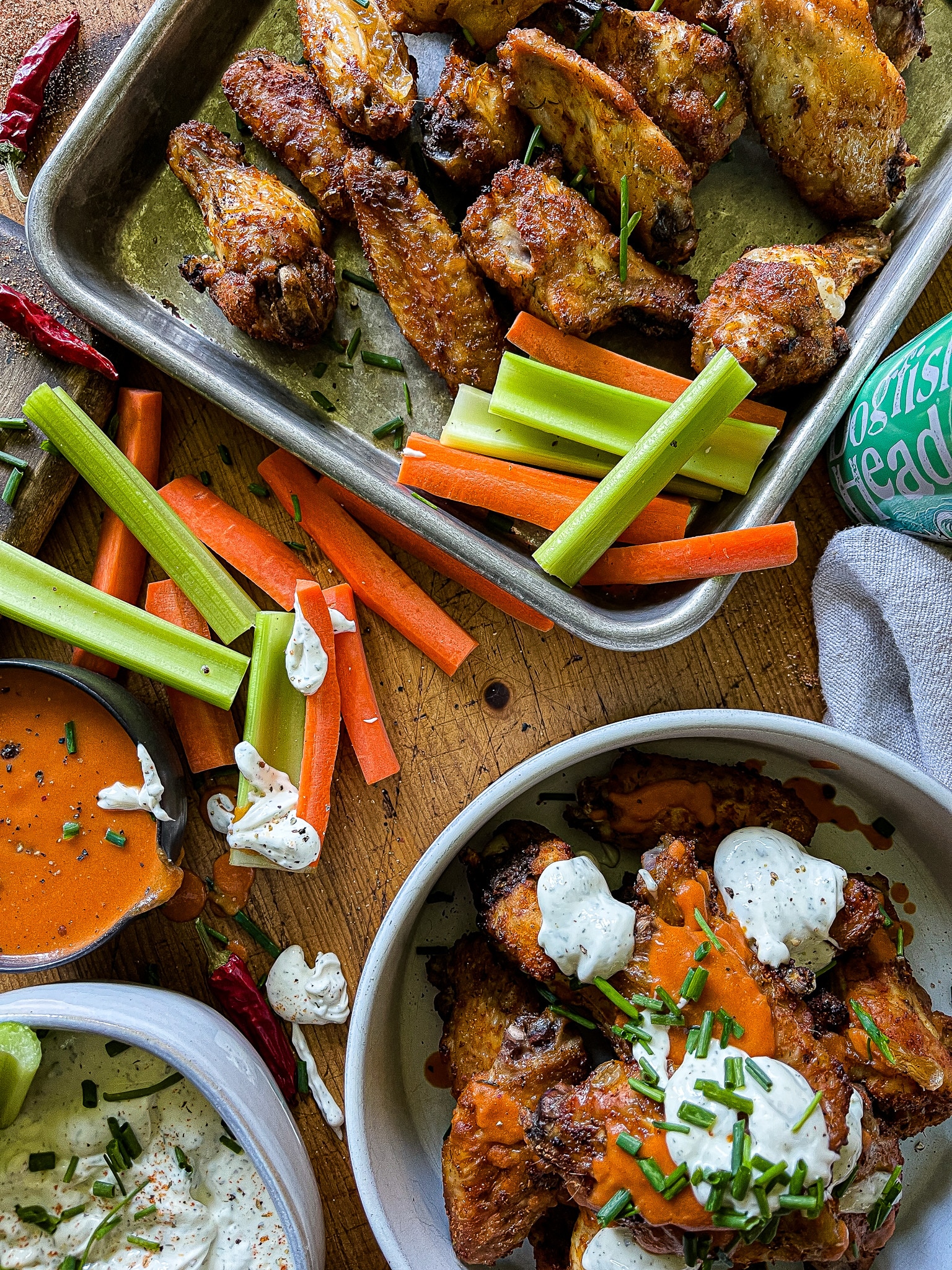 air fryer chicken wings with buffalo and ranch sauces, with carrots and celery sticks