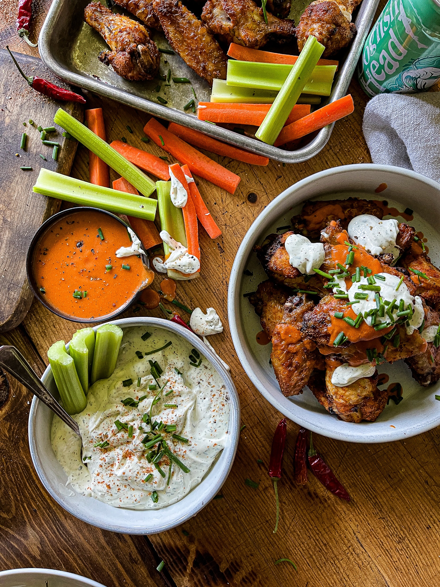 air fryer chicken wings with buffalo and ranch sauces, with carrots and celery sticks