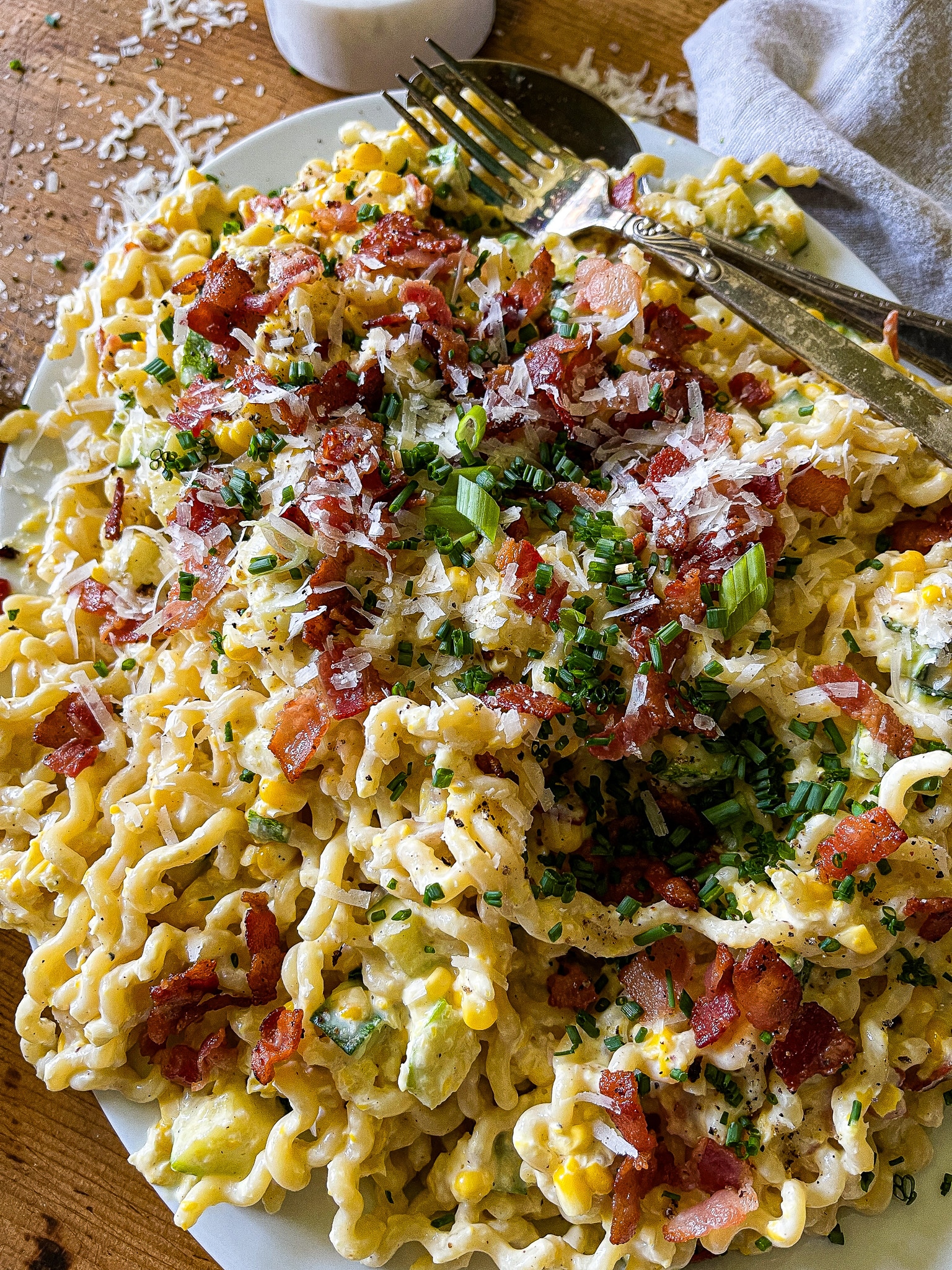 sweet corn pasta with chives, bacon, parmesan garnish