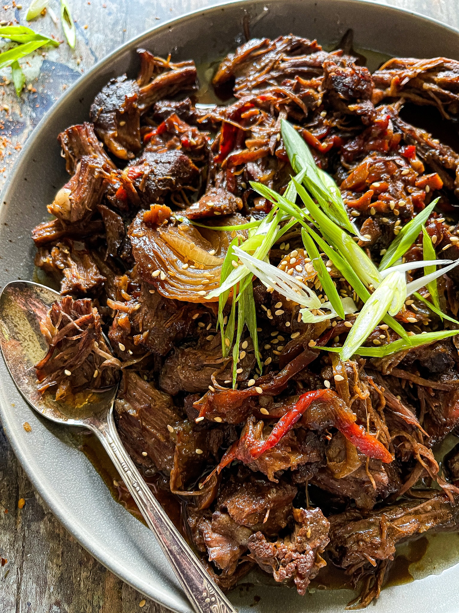 mongolian beef with a green onion garnish