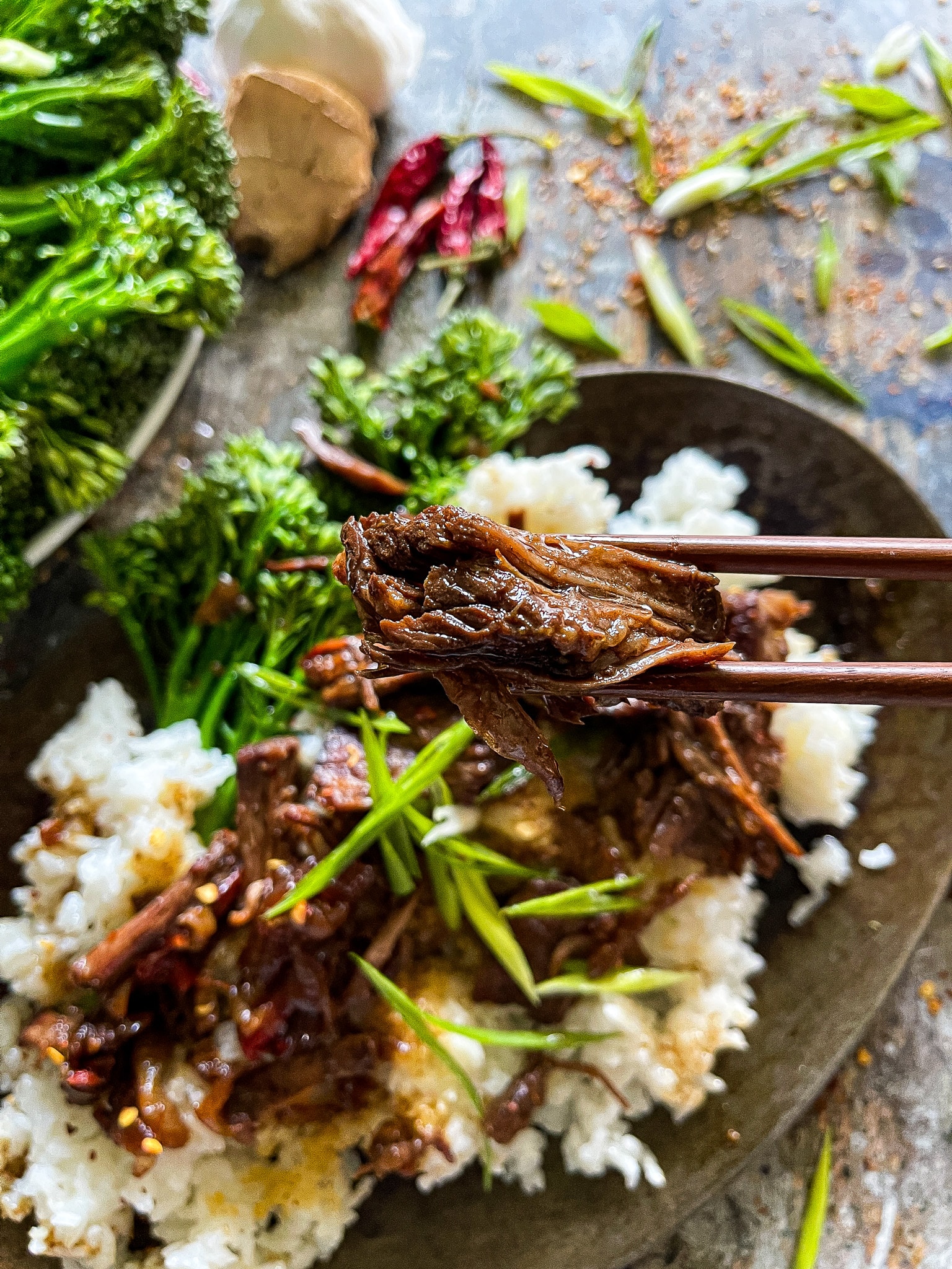 mongolian beef picked up by chopsticks