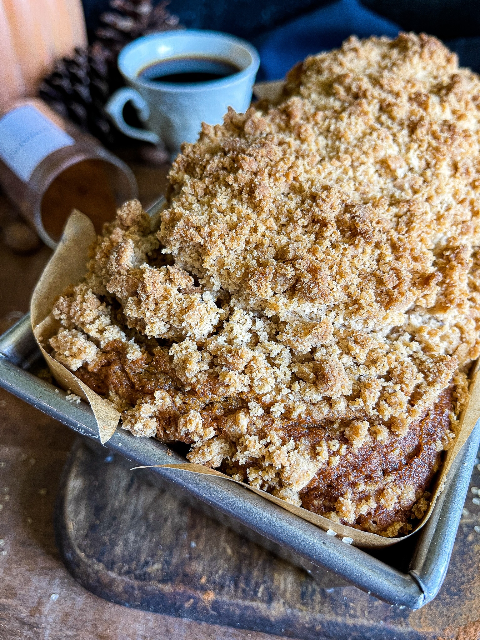 loaf of pumpkin bread with a snickerdoodle crumble