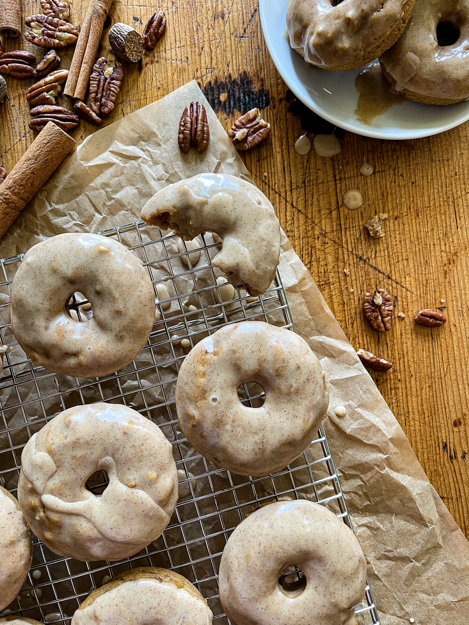 This is a photo of apple cider donuts with a maple glaze.