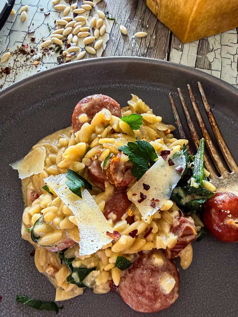 Creamy Italian sausage and orzo with spinach