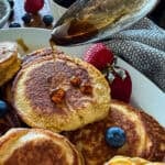 sausage pancakes drizzled with maple syrup