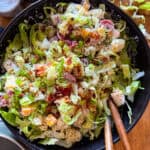 Bacon ranch pasta salad in a black bowl.