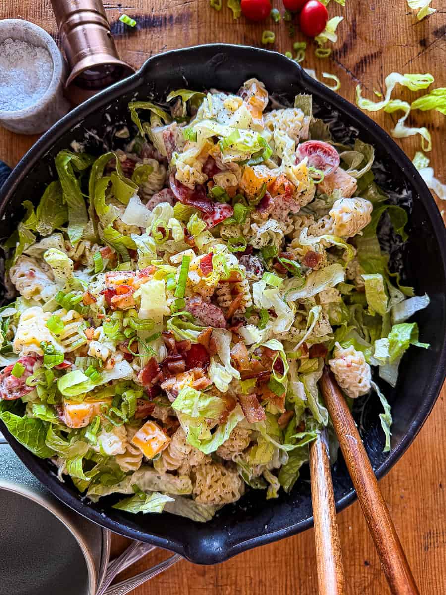 bacon ranch pasta salad in a black serving bowl