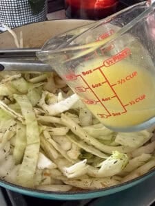 chicken broth in a measuring cup