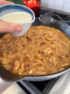 heavy cream in a measuring cup