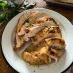 sliced and served turkey breast on a white plate