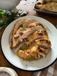 sliced and served turkey breast on a white plate