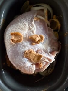 slow cooker turkey breast topped with compound butter